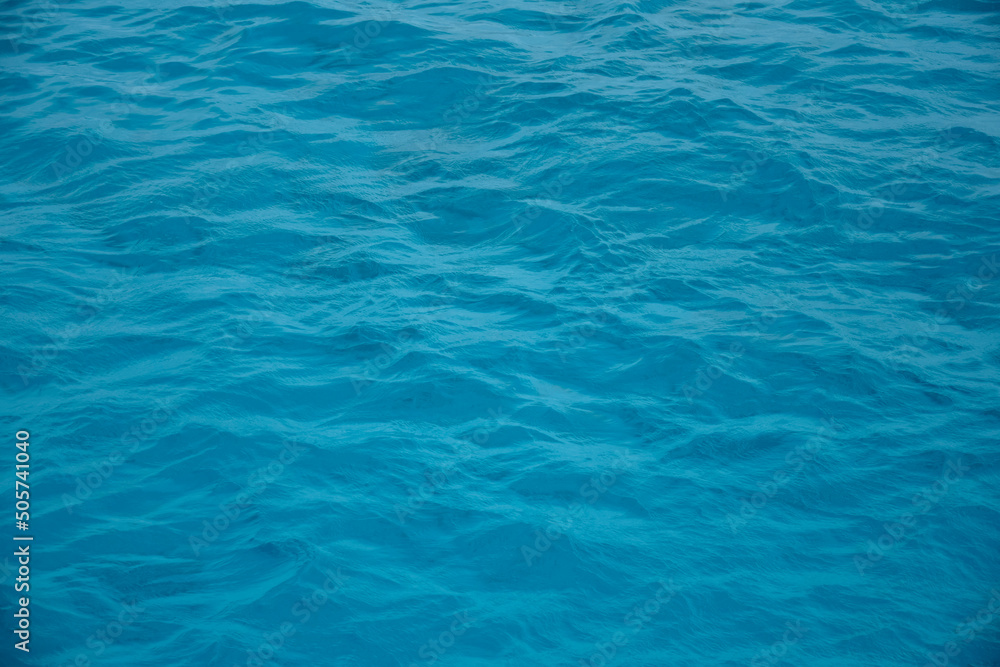 Waves of blue sea water. Abstract background. Copy space. Selective focus. Waves of blue sea water. Abstract background. Copy space. Selective focus.