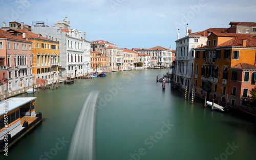 navigable canal and the wake left by the boat of the island of Venice in Italy photographed with long exposure time photo