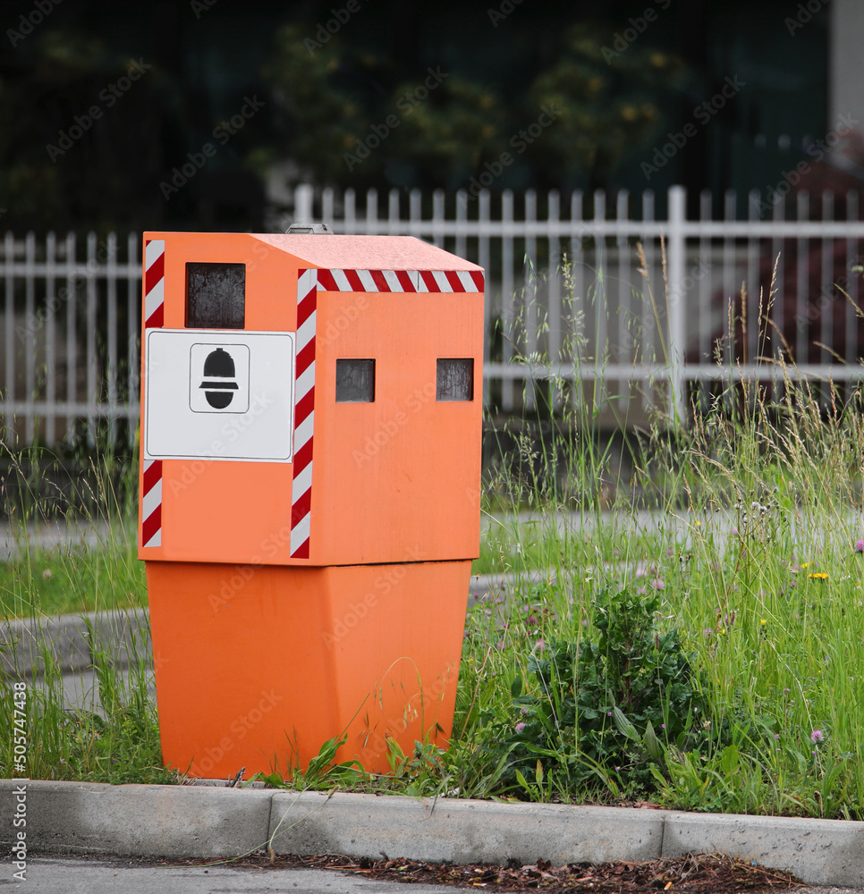 Fotografie Traffic Enforcement Camera on the road with symbol of police