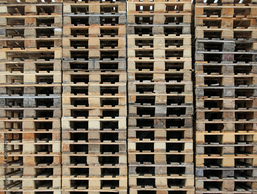 background of hundreds of wooden pallets in the warehouse of the freight forwarder background of hundreds of wooden pallets in the warehouse of the freight forwarder