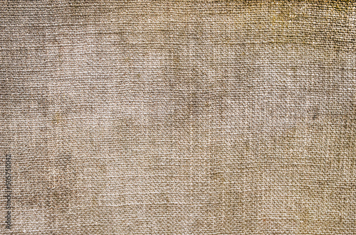 Background, texture of beige fabric, woven burlap close-up. photo