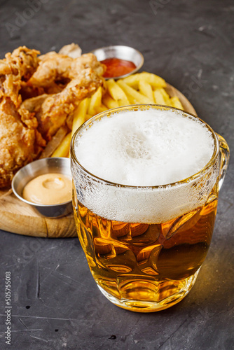 crispy deep-fried chicken drumsticks on a black background