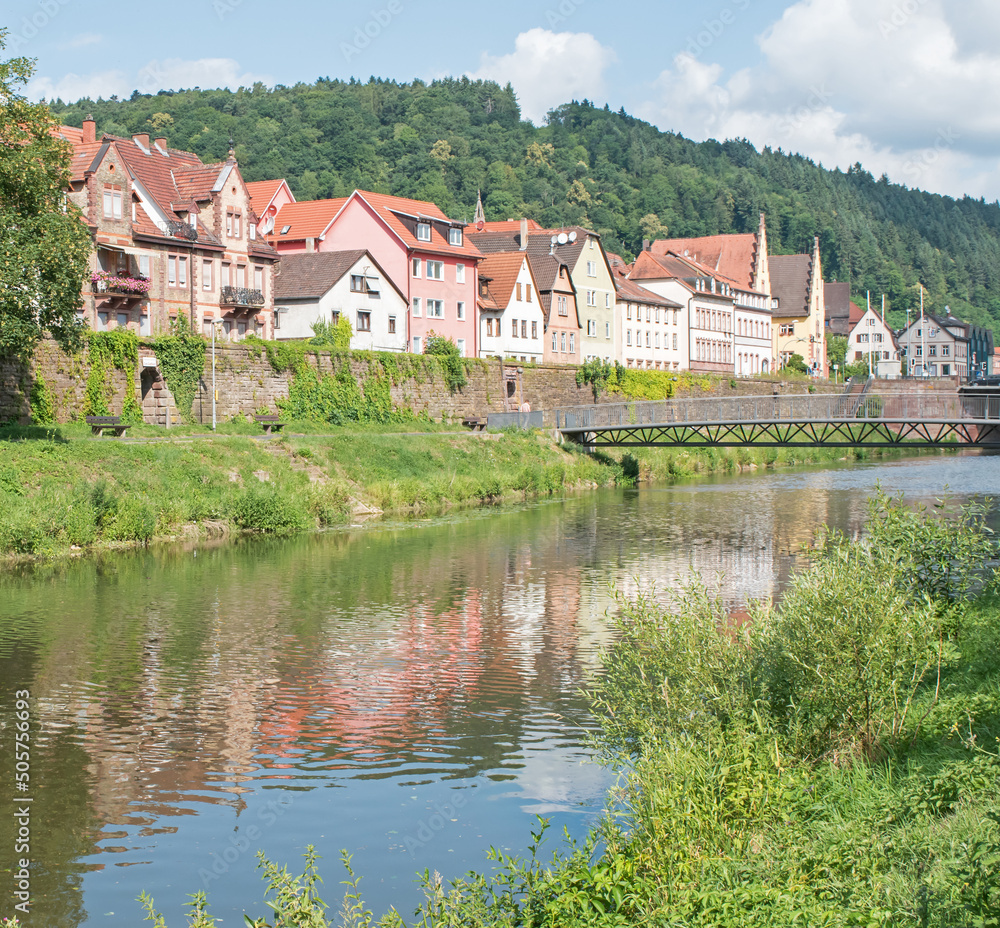 Houses reflect in the waters of the Tauber River, Wertheim, Germany.