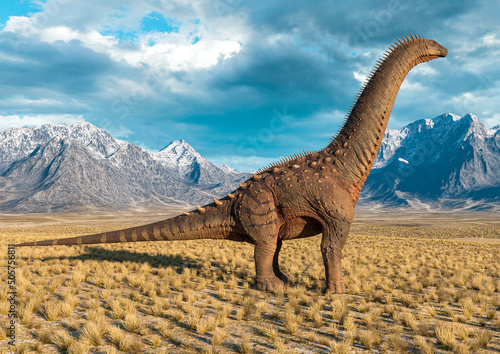 Fototapeta Naklejka Na Ścianę i Meble -  alamosaurus is standing up in the plains and mountains side view