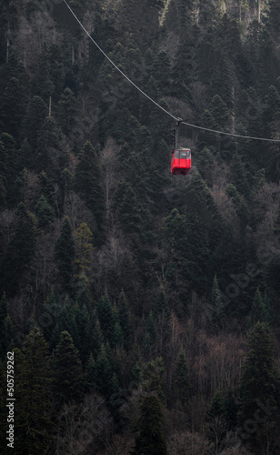 Cable car cabin in mountains with forest