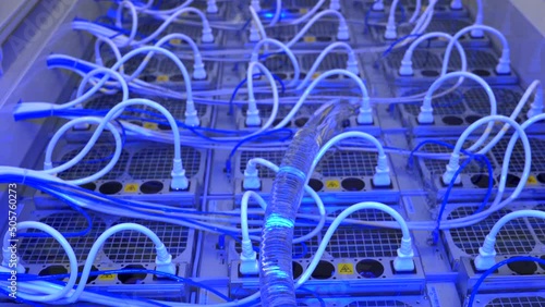 Advanced technology of immersion cooling of computers mining cryptocurrency in liquid for high efficiency in an open bath in a server room