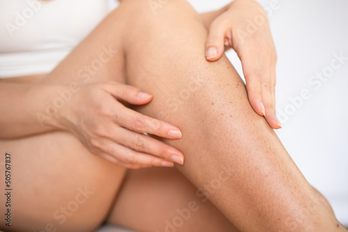 Hygiene skin body care concept. Hair removal. Closeup woman shaving legs with razor blade. After shaving legs irritation with razor. 