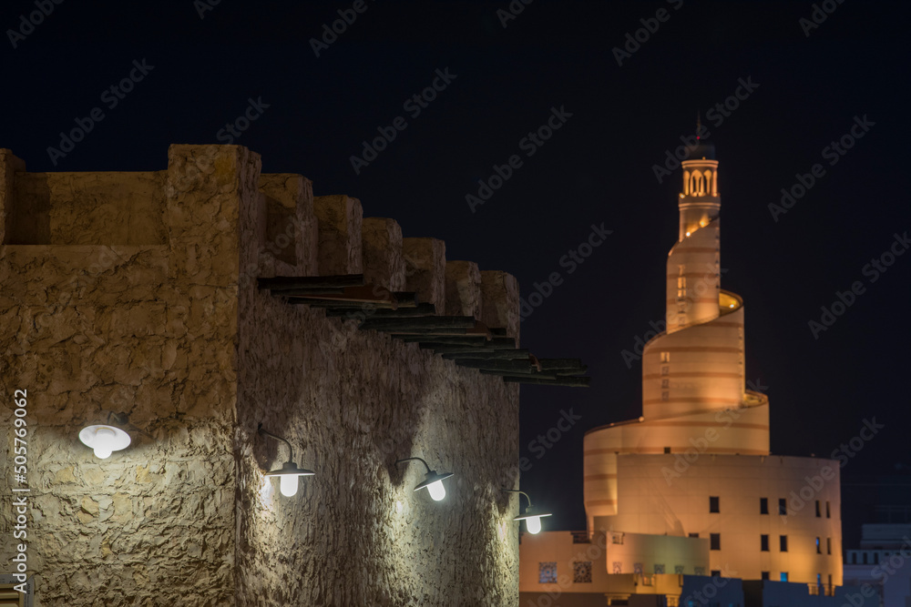 Doha, Qatar, April 22,2022: Night views of the traditional Arabic mosque architecture of Souq Waqif Market.