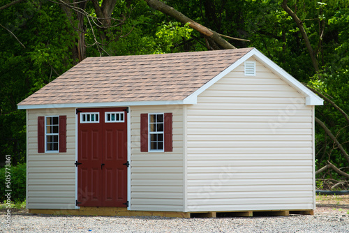 фотографія nice new gray storage shed roof door window