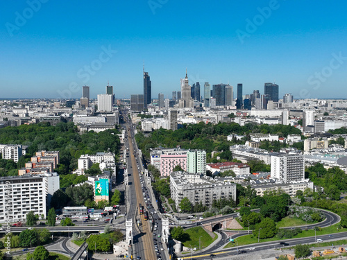 widok z lotu ptaka z drona na centrum Warszawy i most Poniatowskiego, Wisła, dużo zieleni i niebieskie niebo photo