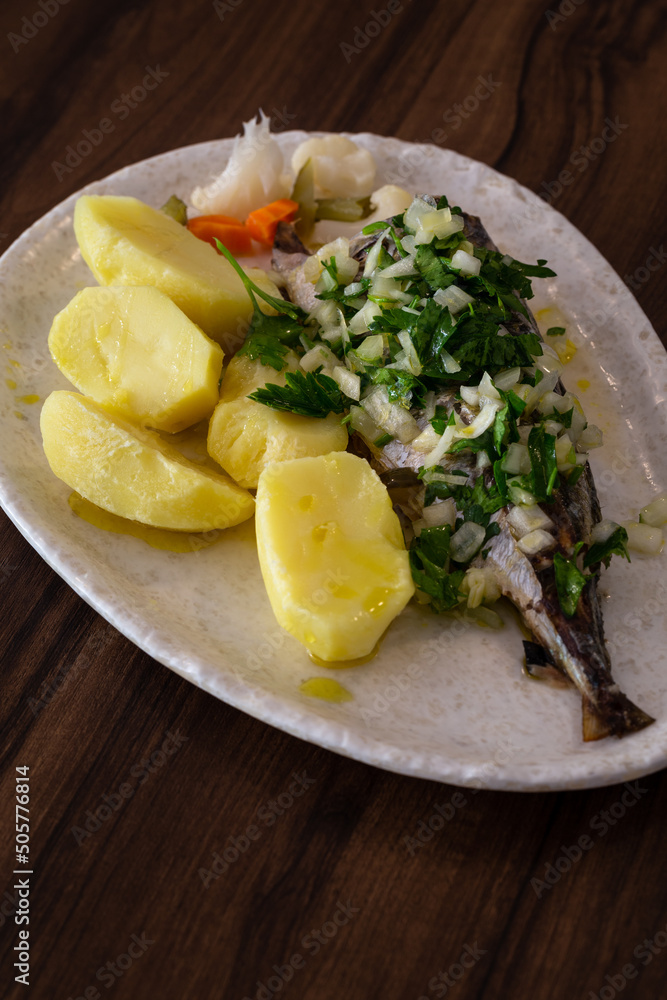 Φωτογραφία The Carapau com molho verde e Batata Cozida is a traditional healthy Mediterranean fish plate, Braga, Portugal