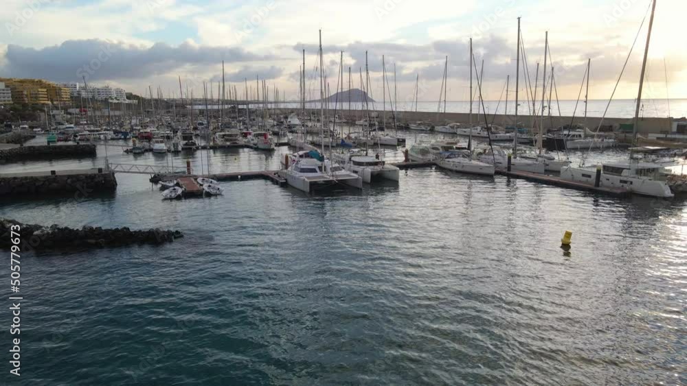 Aerial view of many beautiful yachts are in the marina San Miguel on Canary island Tenerife. Sunset or sunrise Aerial view of many beautiful yachts are in the marina San Miguel on Canary island Tenerife. Sunset or sunrise