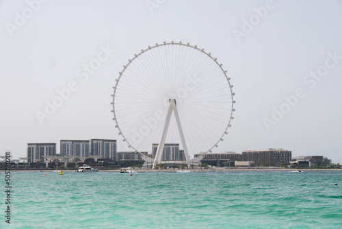 shot from the sea overlooking Dubai ferris wheel © afinocchiaro