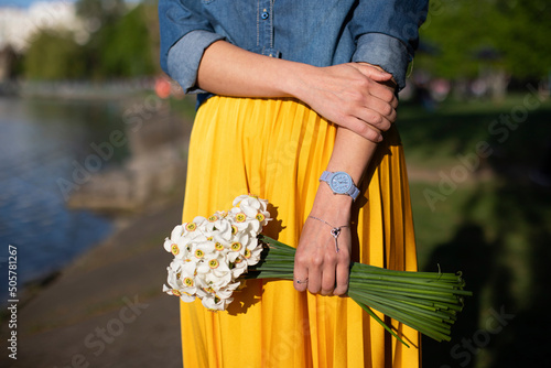bouquet of daffodils in female hands
