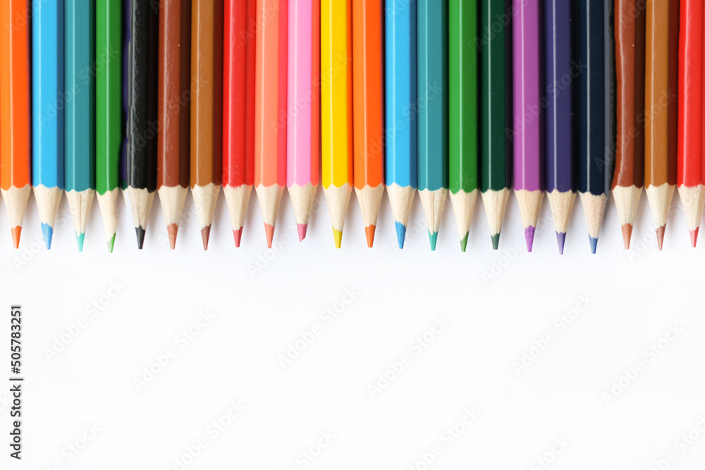 A set of colored pencils isolated on a white background in banner format. Place for text A set of colored pencils isolated on a white background in banner format. Place for text