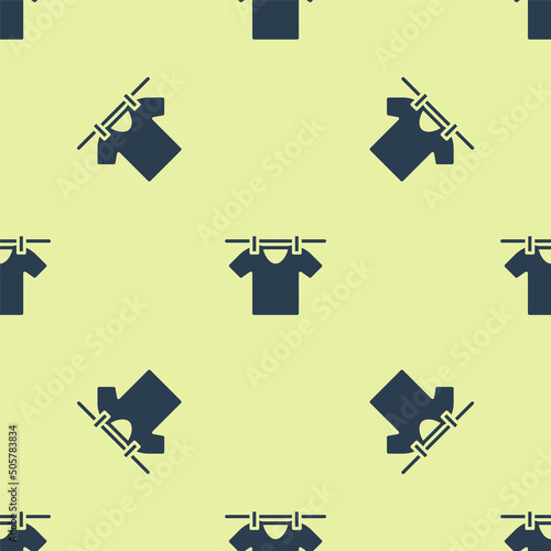 Blue Drying clothes icon isolated seamless pattern on yellow background. Clean shirt. Wash clothes on a rope with clothespins. Clothing care and tidiness. Vector