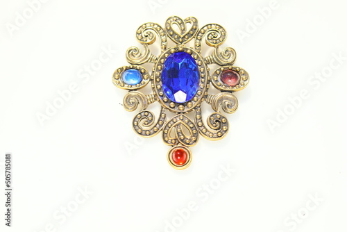 Fotografia Large scrolls antiqued gold tone brooch with blue stone brooch pin costume jewel