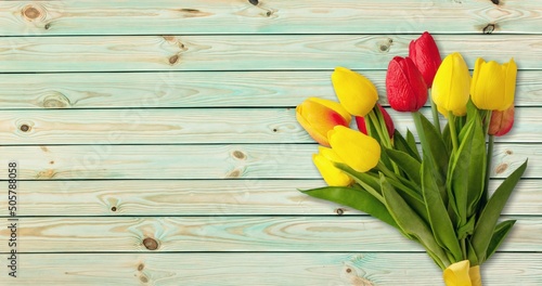 Colorful tulips bouquet on wooden desk