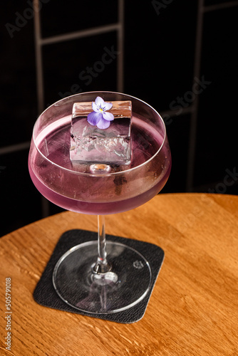 Aviation, drink with gin, lemon juice,maraschino liqueur and violet cream liqueur standing on bar counter