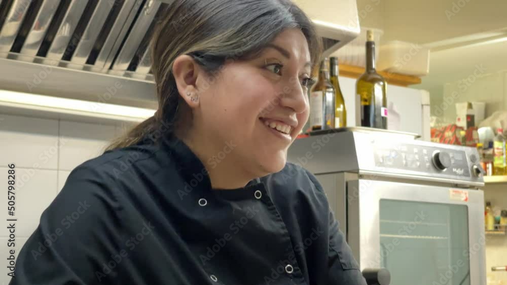 25 years old smiley woman presenting tartare in professional kitchen 25 years old smiley woman presenting tartare in professional kitchen