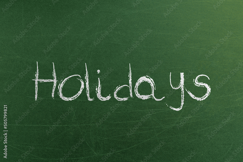 Fototapeta premium Holidays announcement text on the chalkboard. Advertising banners and backgrounds