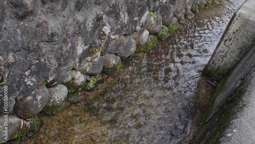 Little irrigation canal ditch running through a village in Japan photo