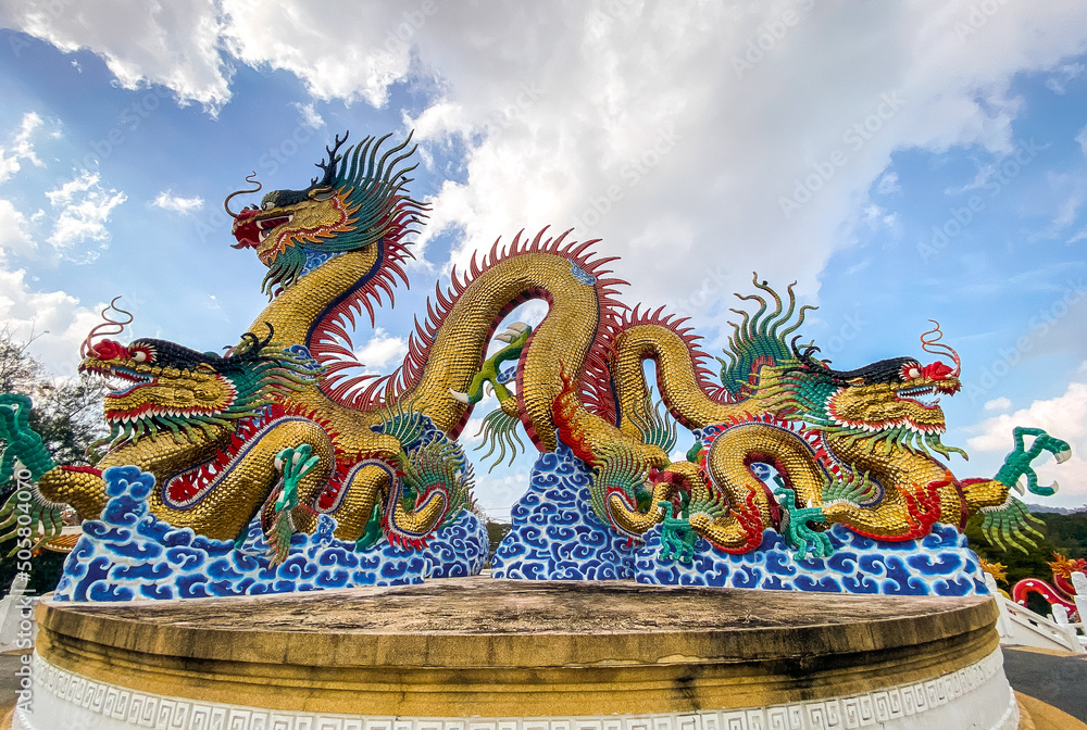 Golden dancing Dragon in Suan Sawan, or Paradise Park in Nakhon Sawan, Thailand Golden dancing Dragon in Suan Sawan, or Paradise Park in Nakhon Sawan, Thailand