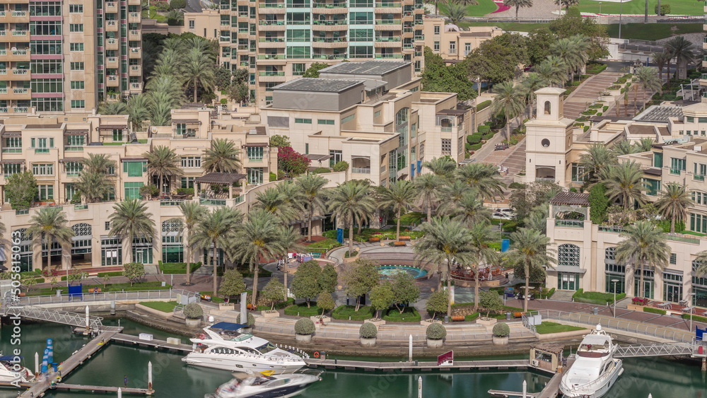 Picturesque fountain on Dubai Marina promenade aerial timelapse