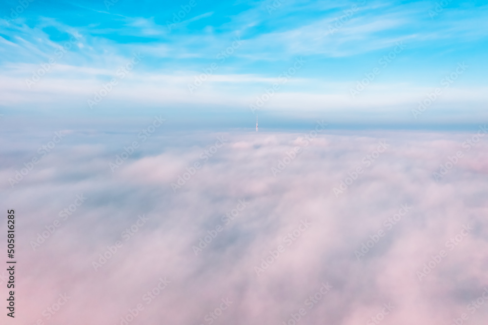 Sky above the clouds, aerial view of thick fog and clouds lying above the ground, beautiful landscape and background
