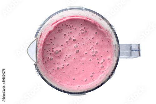Summer strawberry or raspberry smoothie in blender jar, strawberry shake, detox drink, top view, isolated on white