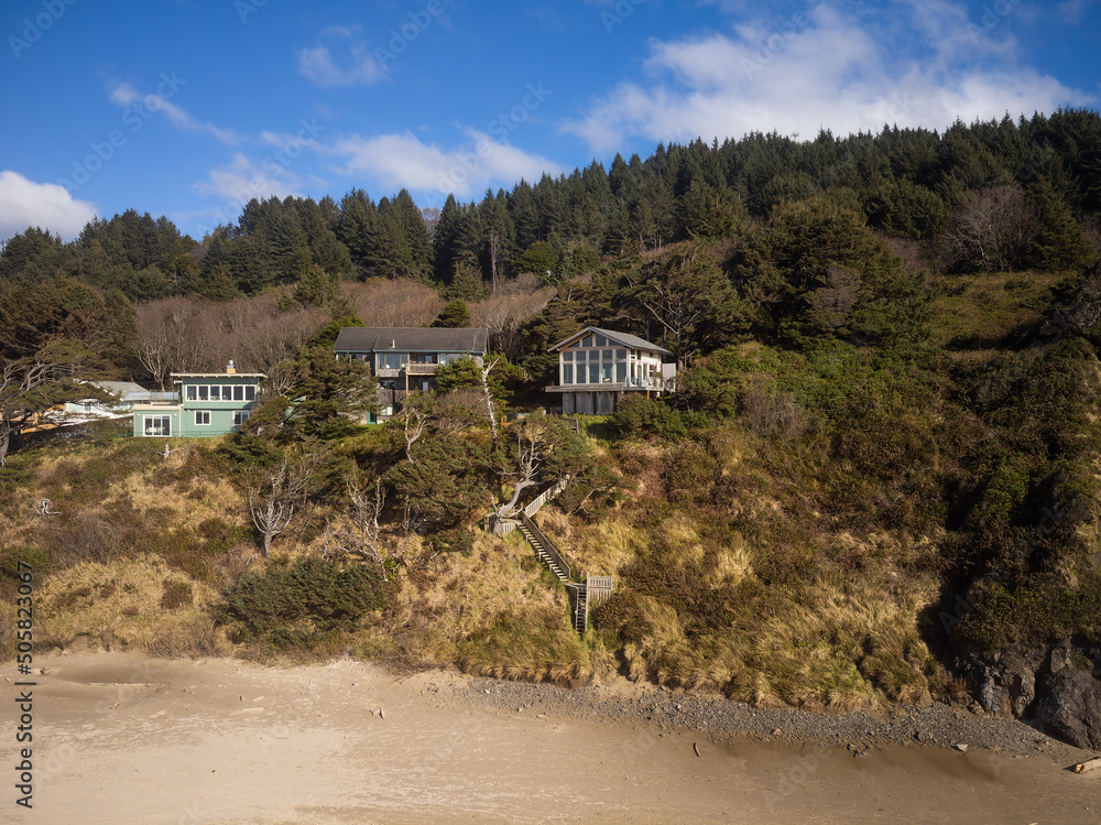 Paradise corner of nature. Small houses on the hilly bank of the river. Forest, blue sky. Beautiful nature. Housing and environmental issues, tourism. rest. There are no people in the photo. Paradise corner of nature. Small houses on the hilly bank of the river. Forest, blue sky. Beautiful nature. Housing and environmental issues, tourism. rest. There are no people in the photo.