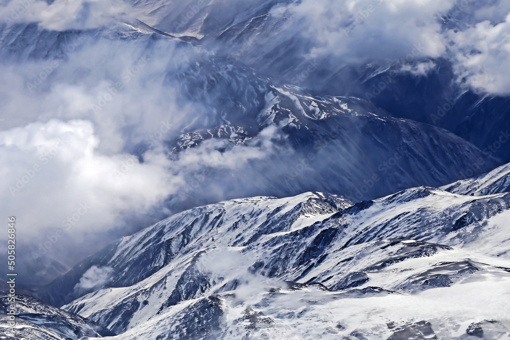 View of the high mountain on the window of air plane