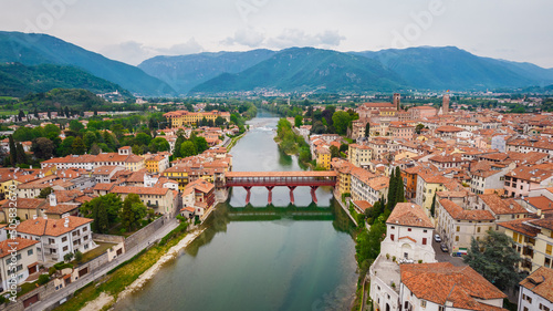 Fotografia Aerial View of the Alpini Bridge with the Brenta River in Bassano del Grappa, Vi