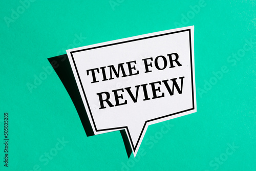 Time for review reminder speech bubble isolated on the green background. photo