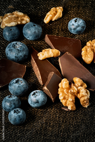 Chocolate, nuts and blueberries prepared for a healthy meal