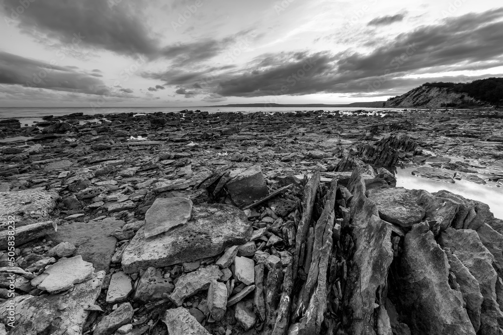 Exciting sunset at sea rocky coast and beauty sky