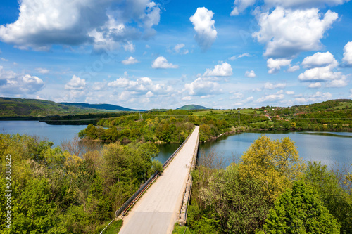 Spectacular aerial view from a drone at a bridge over a lake. Yovkovtsi, Bulgaria