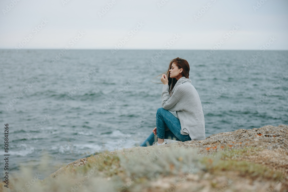 beautiful woman long hair nature rocks coast landscape female relaxing