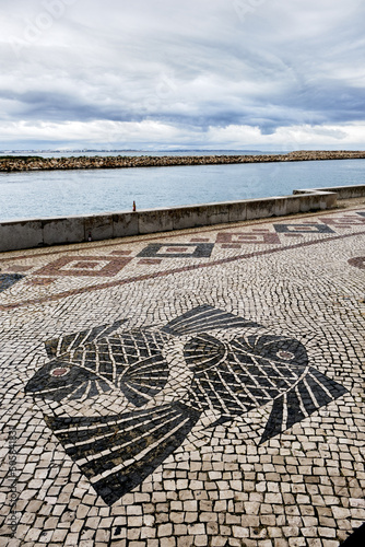 Traditional Portuguese style Calcada Pavement for pedestrian area in Lagos, Algarve, Portugal photo