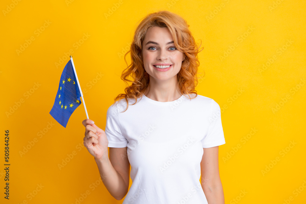 Caucasian student girl holding small flag with european union emblem. European flags concept. Caucasian student girl holding small flag with european union emblem. European flags concept.