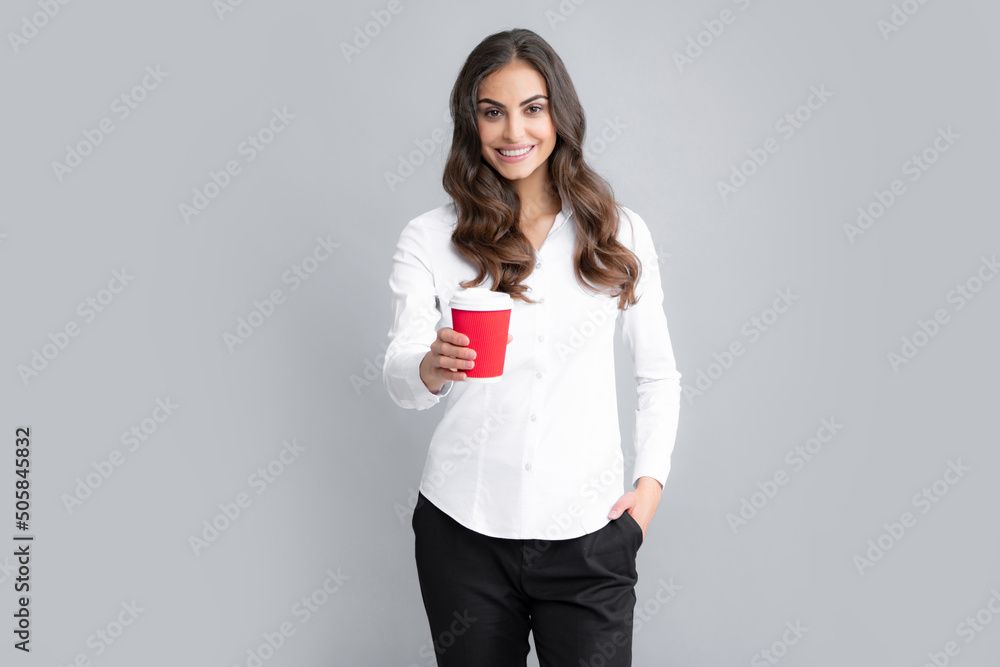 Happy girl enjoying coffee, isolated on yellow. Cheerful young woman hold coffee cup. Happy girl enjoying coffee, isolated on yellow. Cheerful young woman hold coffee cup.