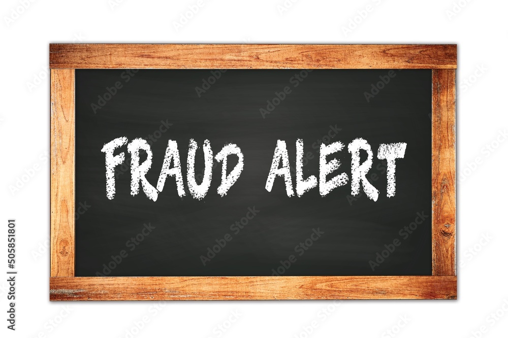 Fototapeta premium FRAUD ALERT text written on wooden frame school blackboard.