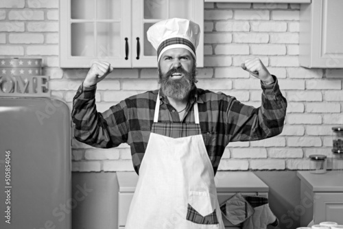 Funny chef with beard cook. Beard man and moustache wearing bib apron.