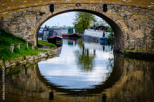 09.04.2022 Tring, England, UK - Beautiful Tring canal with boats and water reflection