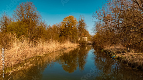 Beautiful spring view with reflections at Infohaus Isarmuendung, Moos, Bavaria, Germany © Martin Erdniss