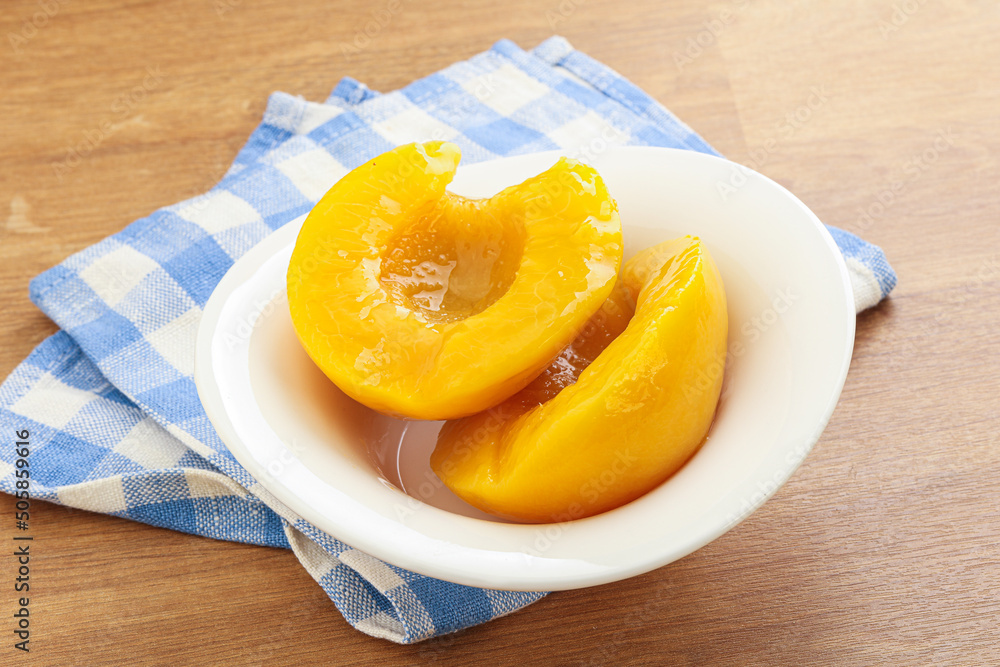 Sweet canned peaches with syrope Sweet canned peaches with syrope