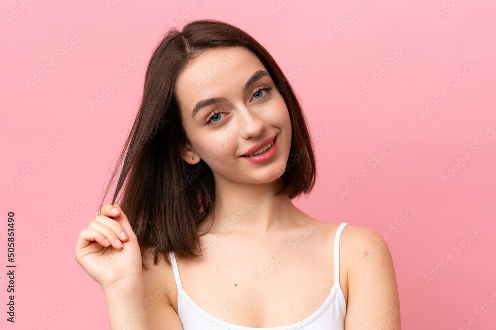 Young Ukrainian woman isolated on pink background . Portrait Young Ukrainian woman isolated on pink background . Portrait