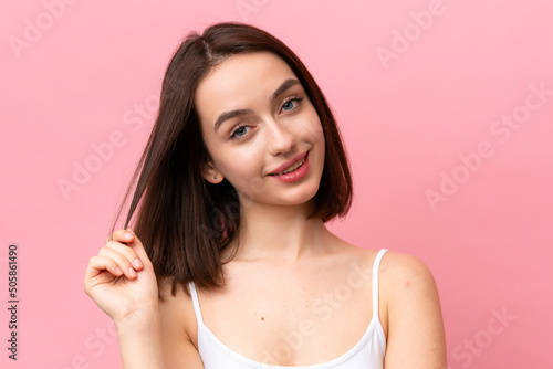 Young Ukrainian woman isolated on pink background . Portrait