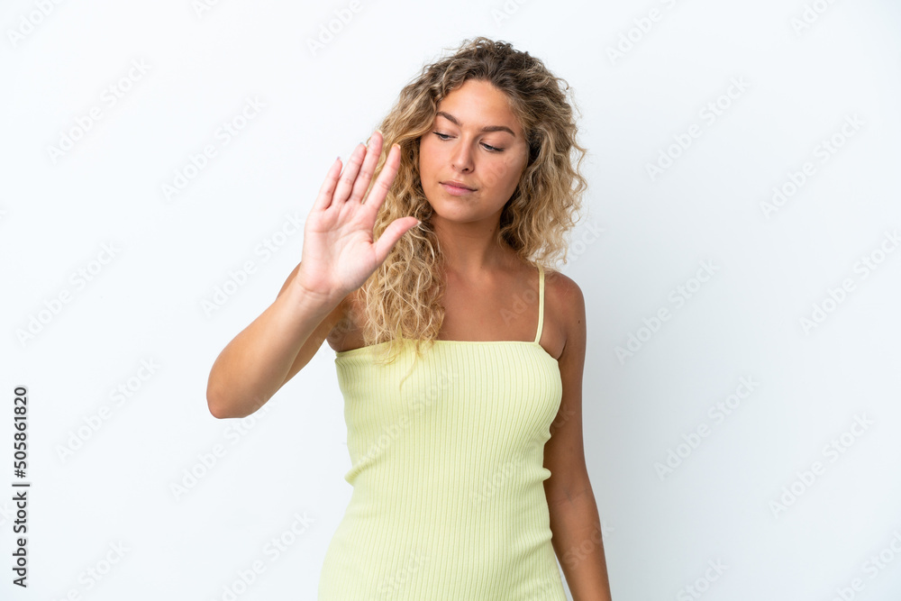Girl with curly hair isolated on white background making stop gesture and disappointed Girl with curly hair isolated on white background making stop gesture and disappointed