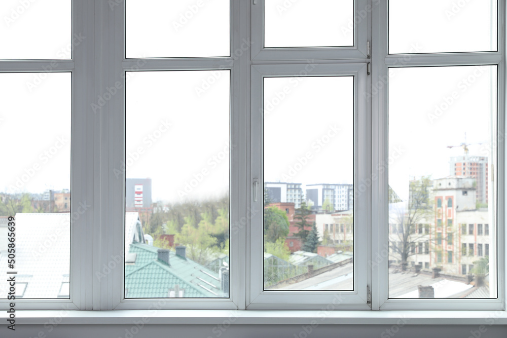 Fototapeta premium Stylish window with white frame in office
